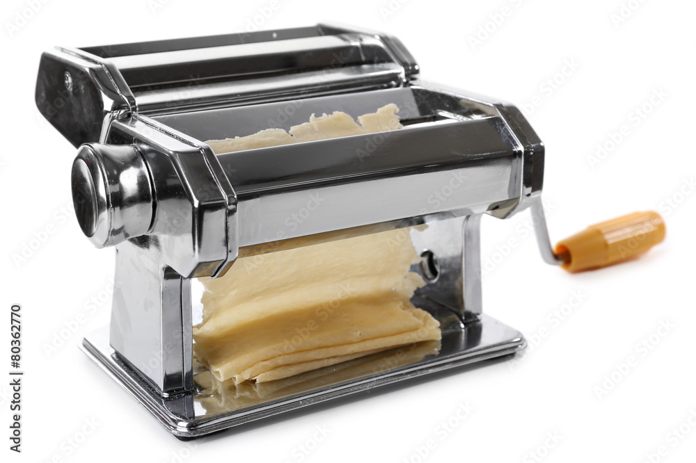 Metal pasta maker machine with dough isolated on white Metal pasta maker machine with dough isolated on white