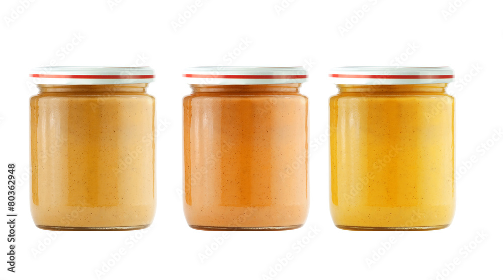 Jars of baby puree isolated on white Jars of baby puree isolated on white