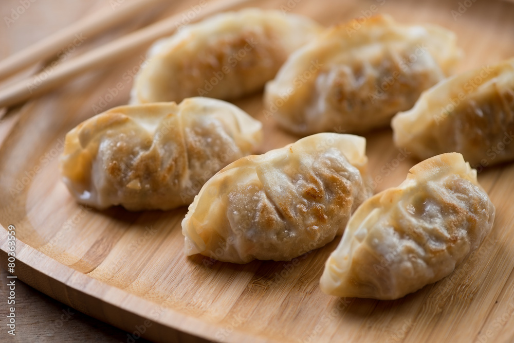Pan fried japanese gyoza dumplings, close-up, selective focus Pan fried japanese gyoza dumplings, close-up, selective focus