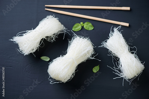 Raw bean threads noodles over black wooden surface