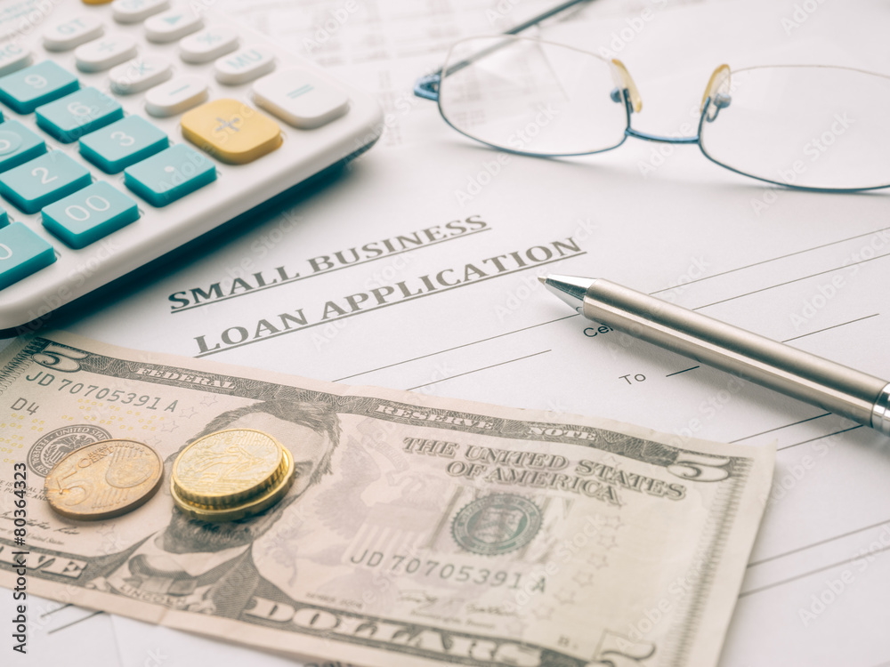 small business loan application on the desk. small business loan application on the desk.