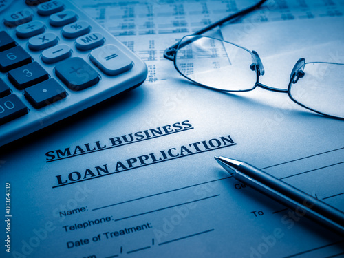small business loan application on the desk.