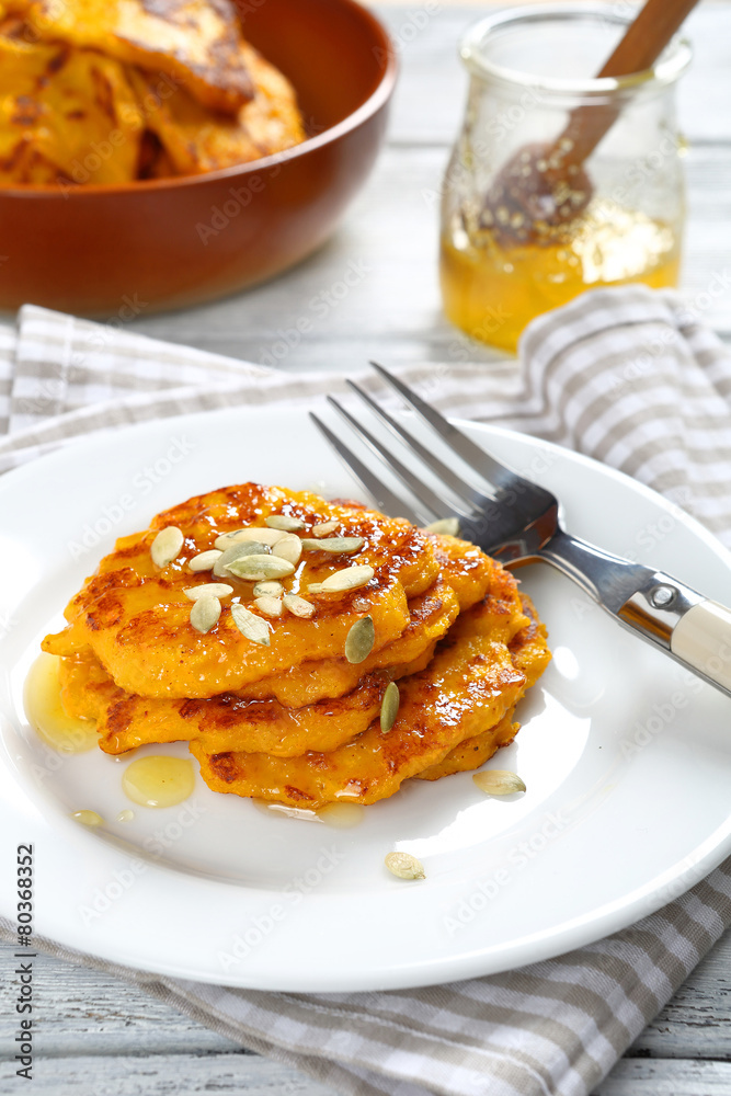 Sweet pumpkin pancakes on a plate Sweet pumpkin pancakes on a plate