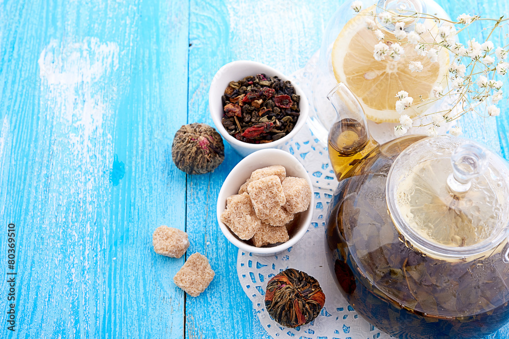 drink in glass teapot on wooden background drink in glass teapot on wooden background