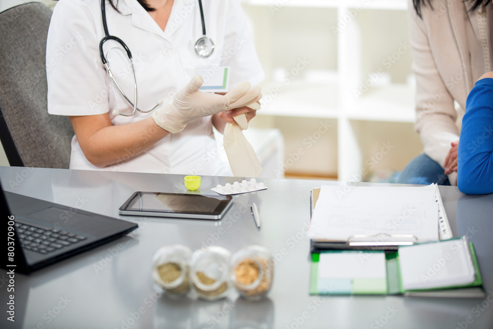 Doctor gives homeopathic pills child Doctor gives homeopathic pills child