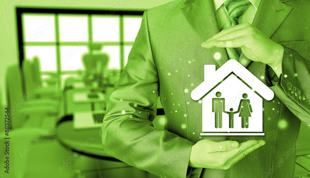businessman protecting family in home with hands businessman protecting family in home with hands