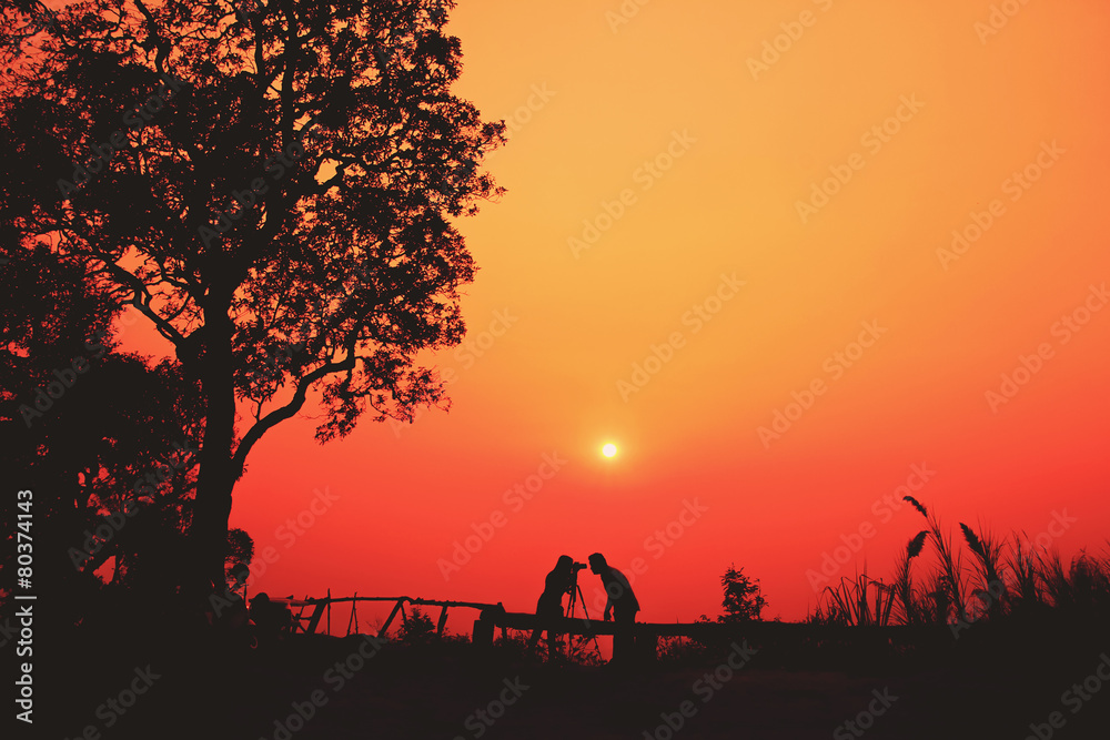 Young couple having fun at sunset time