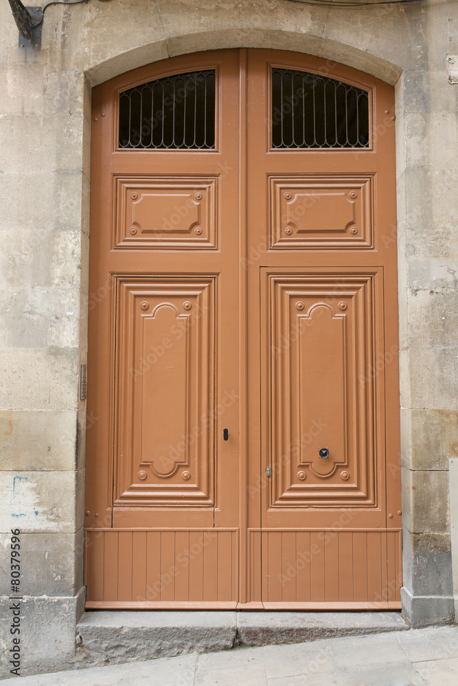 Wooden classic door in the street.