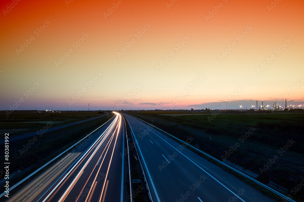 Cars speeding on a highway