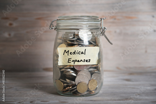 Money jar with medical expenses label.