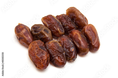 Medjool dates isolated on a white background.