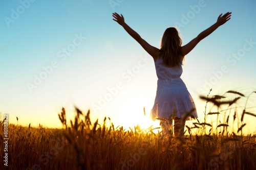 Arms. Teenage girl enjoy with sunshine in wheat field