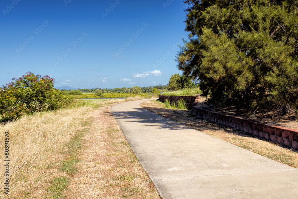 Narrow footpath goes along fields