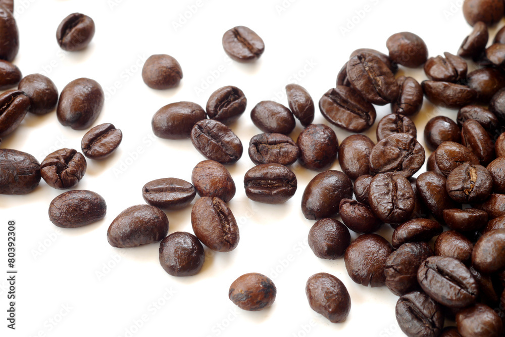 Brown coffee beans isolated on white background Brown coffee beans isolated on white background