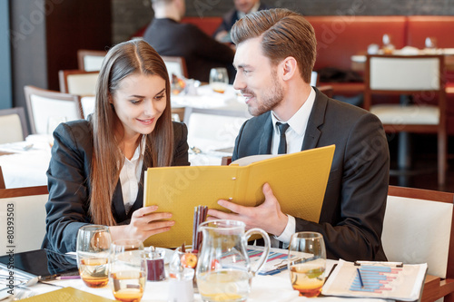 Business partners examine the documents