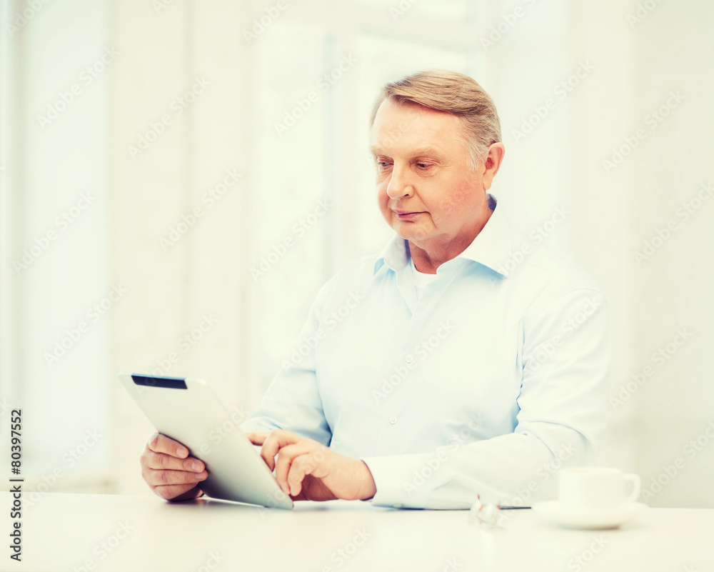 old man with tablet pc computer at home old man with tablet pc computer at home