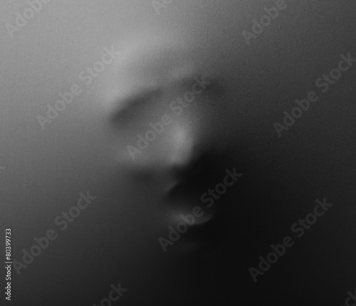 Bilde på lerret Screaming human face pressing through fabric as horror