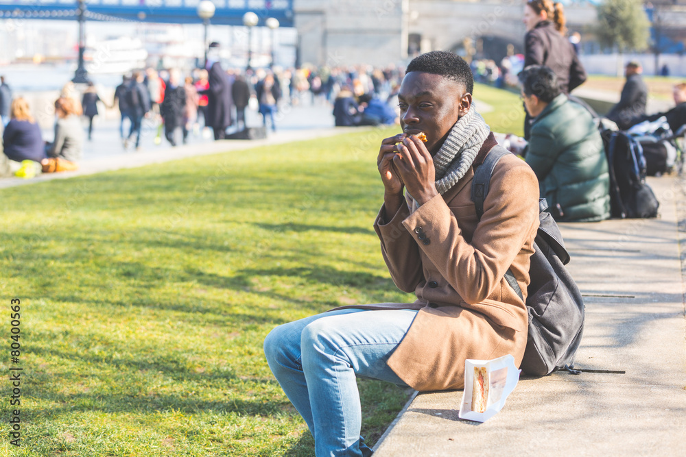 Young man having lunch break in London Young man having lunch break in London