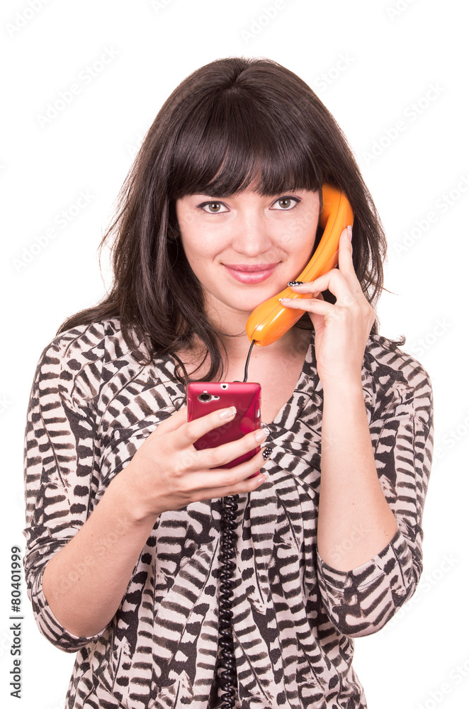 beautiful young woman using retro orange and mobile phone beautiful young woman using retro orange and mobile phone