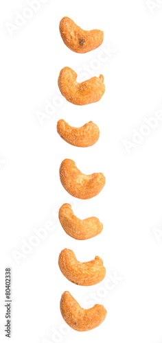 Roasted and salted cashew nut over white background
