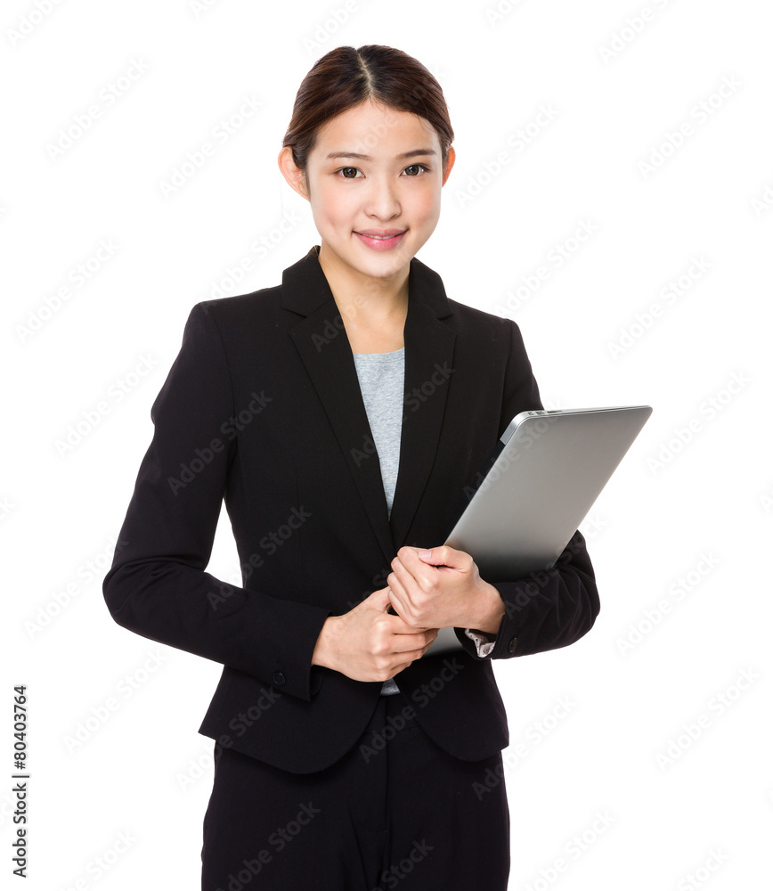 Attractive smiling young woman holding laptop computer Attractive smiling young woman holding laptop computer