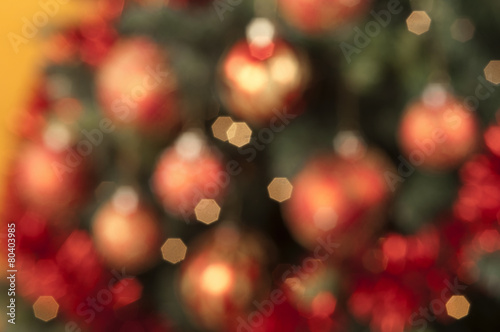 Closeup of colored Christmas balls out of focus on colored backg
