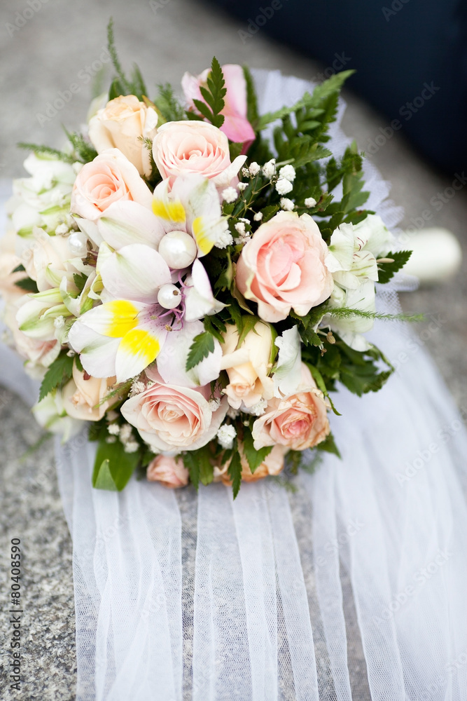 Fototapeta premium Pastel wedding bouquet with roses