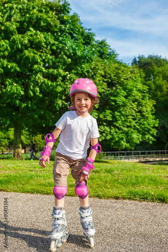 Smiling girl roller skating