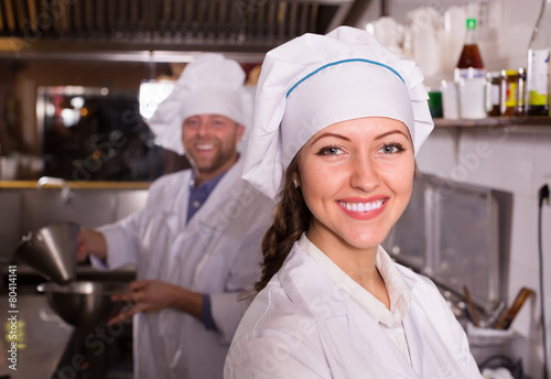 Chef and his helper at bistro kitchen
