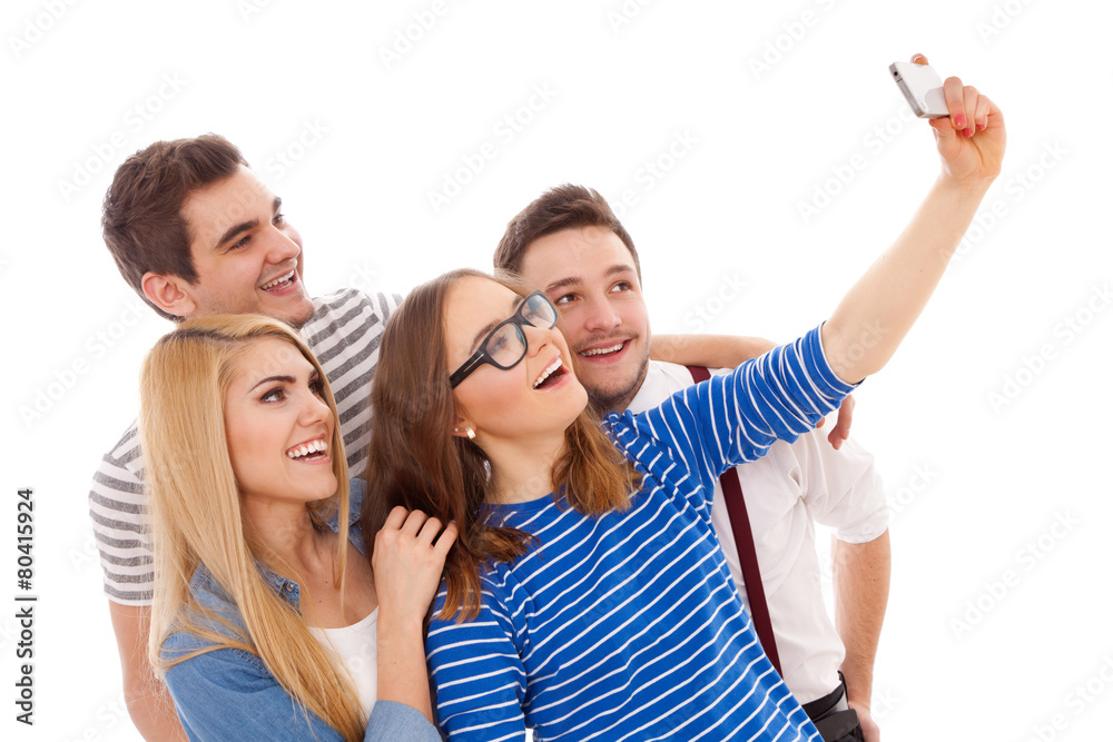Obraz premium Four stylish young people on white background