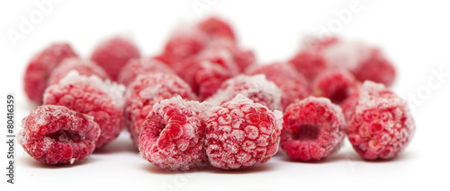 Frozen raspberries on white