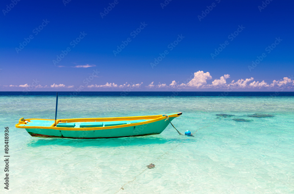 Colourful boat on a wonderful crystal clear ocean