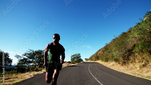 Fast African American athlete sprinting during fitness training slow motion photo