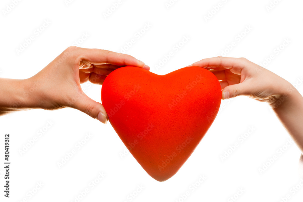 Fototapeta premium Red heart in man hands, isolated on white