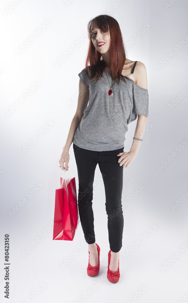 Teenage Woman Holding Single Red Shopping Bag Teenage Woman Holding Single Red Shopping Bag