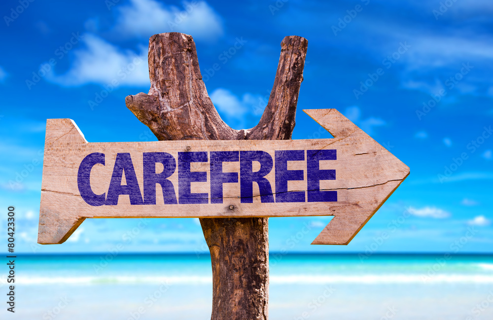 Carefree sign with a beach on background