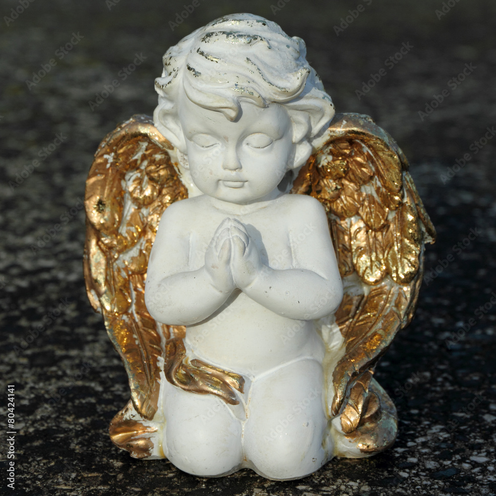 praying angelic little figurine - obrazy, fototapety, plakaty 