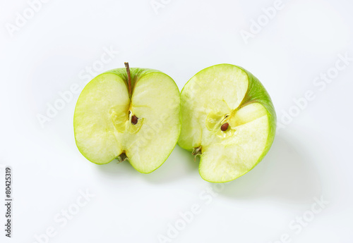 Halved green apple