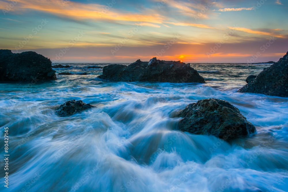 Rocks and waves in the Pacific Ocean at sunset, at Thousand Step Rocks and waves in the Pacific Ocean at sunset, at Thousand Step