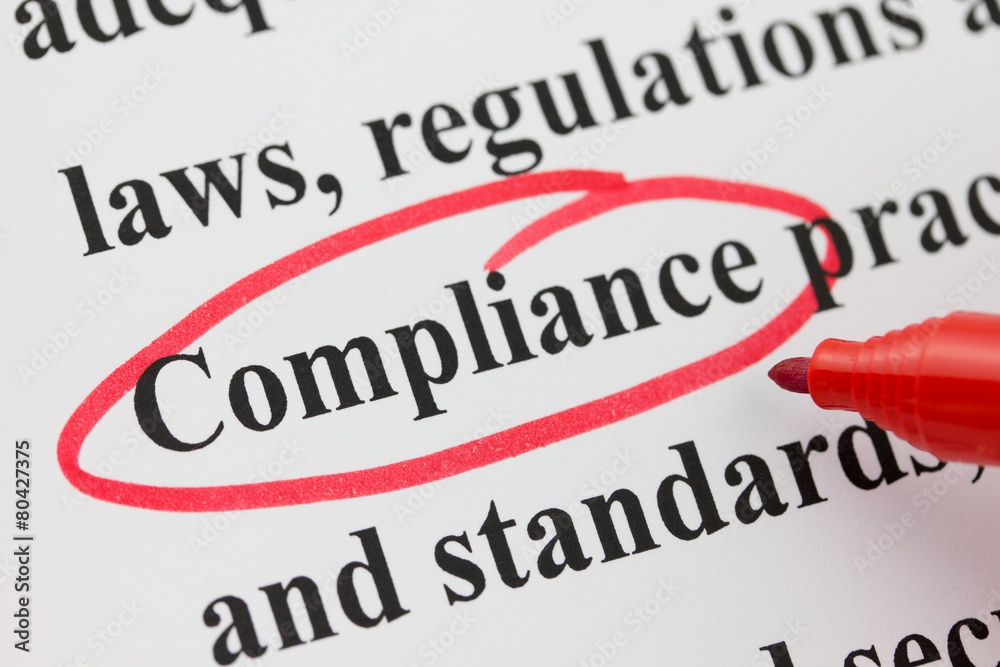 Word Compliance Circled in Red Pen Closeup Word Compliance Circled in Red Pen Closeup