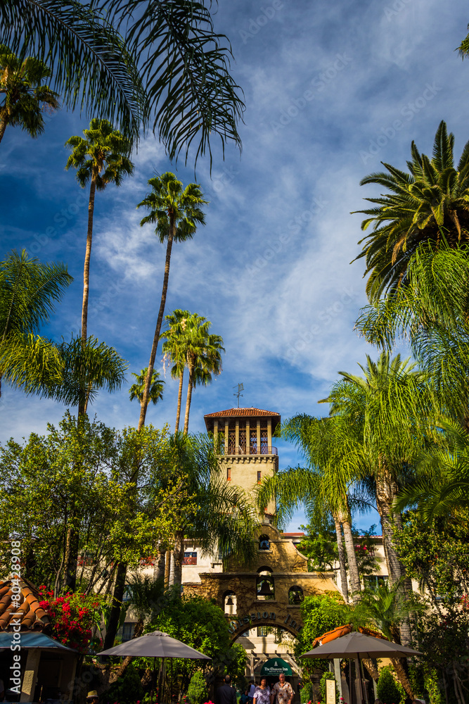 Palm trees and the exterior of the Mission Inn, in Riverside, Ca