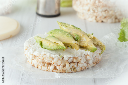 rice cake with cream cheese and avocado