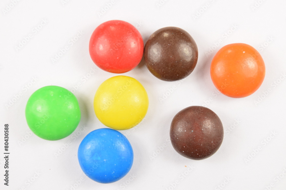 Colorful candies spread on white background. Colorful candies spread on white background.