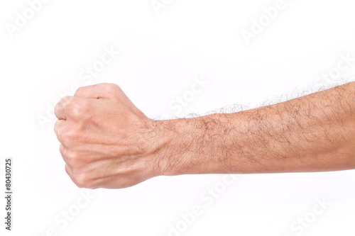 man's fist with hairy arm