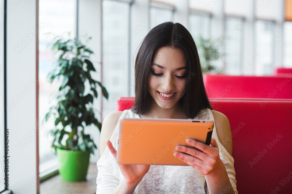 Beautiful girl working with high technology