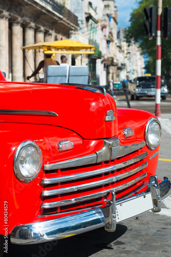 Beautiful vintage car on a street in downtown Havana © kmiragaya