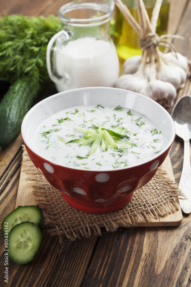 Summer soup with cucumbers, yogurt and fresh herbs