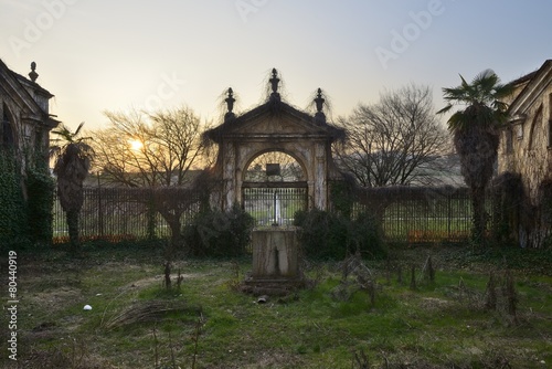 Old abandoned gate of an ancient villa.