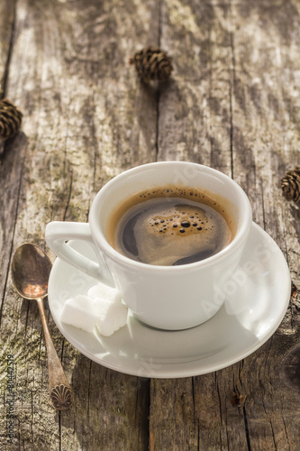 coffee cup black wooden board brown pines white