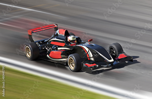 Obraz na plátně F1 racing závodní auto na trati s motion blur